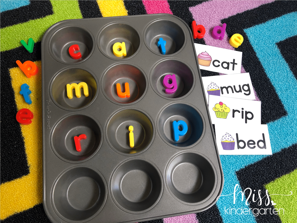 A picture of a muffin tin with magnet letters inside the each circle to spell a CVC word.