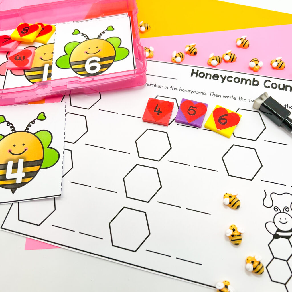 Honeycomb Counting Valentine's Day center is being used with heart-themed number counters.