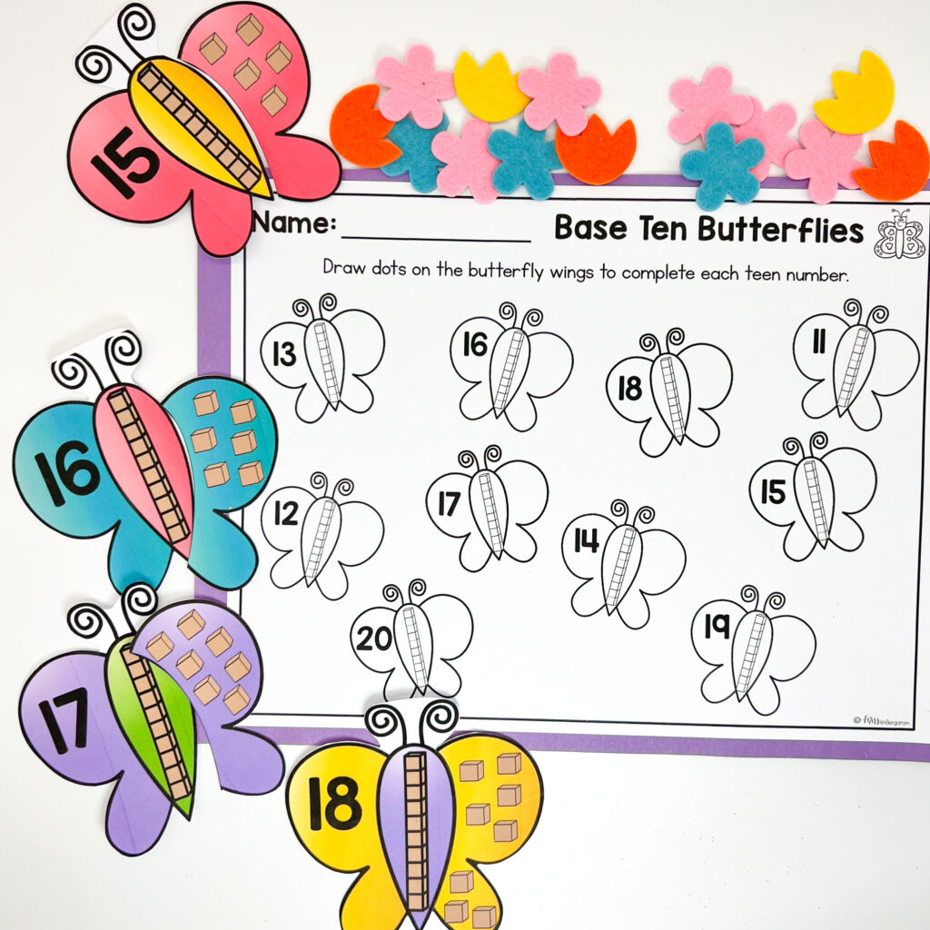 Paper butterfly wings are being matched to create the correct teen number.