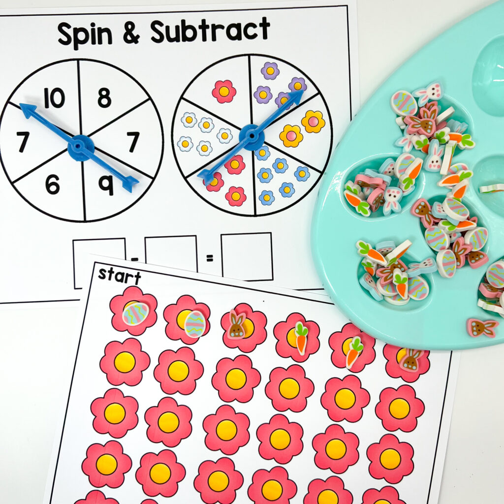 Small Easter-themed erasers are being used for a spin and subtract kindergarten center activity.