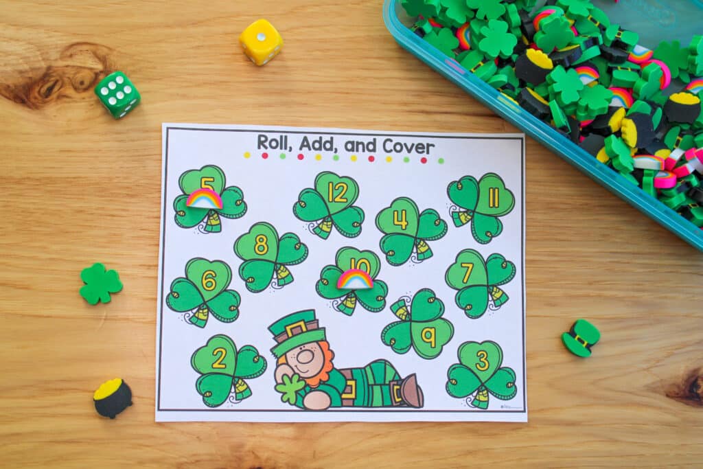 A St. Patrick's Day roll and cover activity is being used with themed mini erasers.