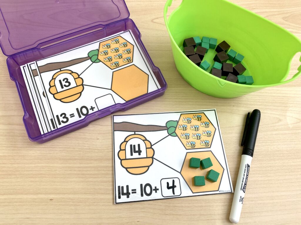 A bee-themed number bond activity is being used with small unit blocks.