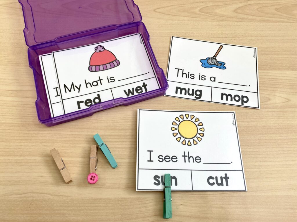 A read and clip center activity is being used with clothes pins.