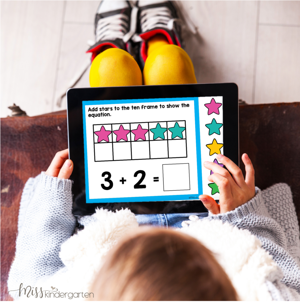 A child is using an iPad to complete a digital addition activity.