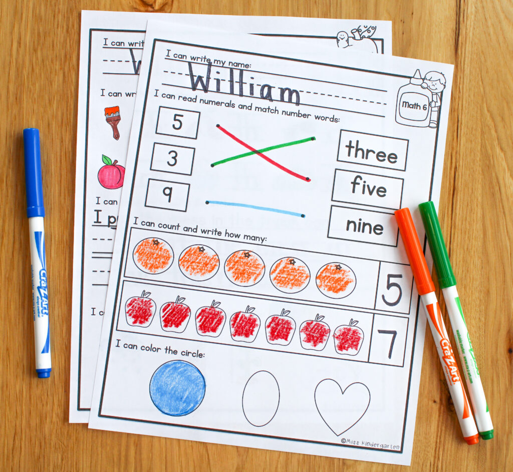 Two first grade morning work worksheets colored with marker.