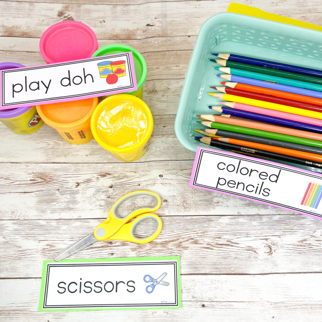 Labels added to colored pencils, play doh, and scissors