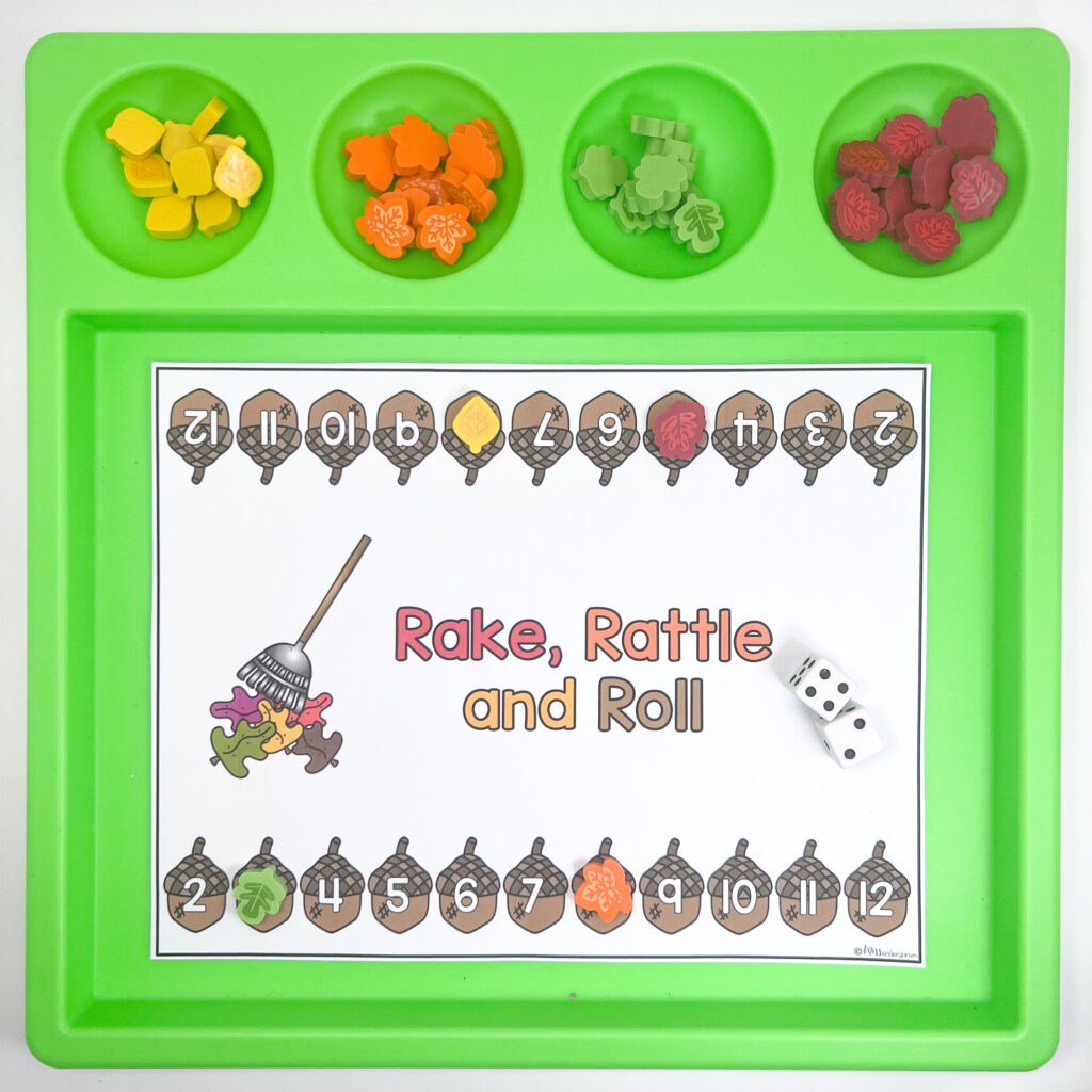 A Rake, Rattle, and Roll game on a green tray