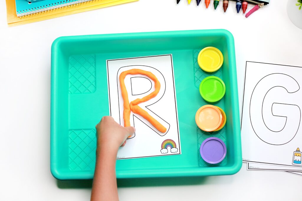 Building the letter R with play dough