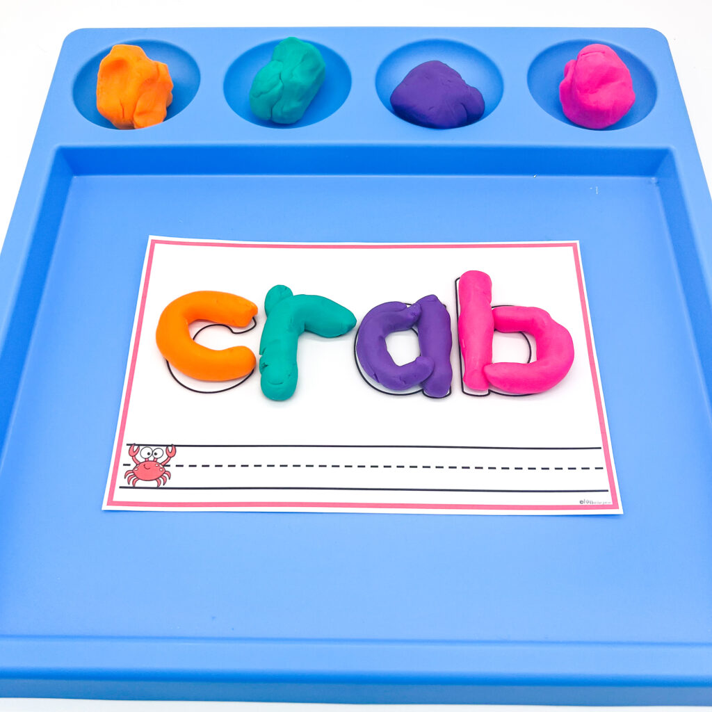 Spelling the word "crab" on a play dough mat
