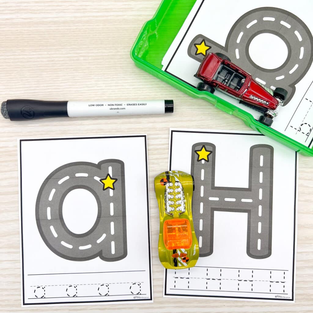 Letter road task cards with a yellow toy car