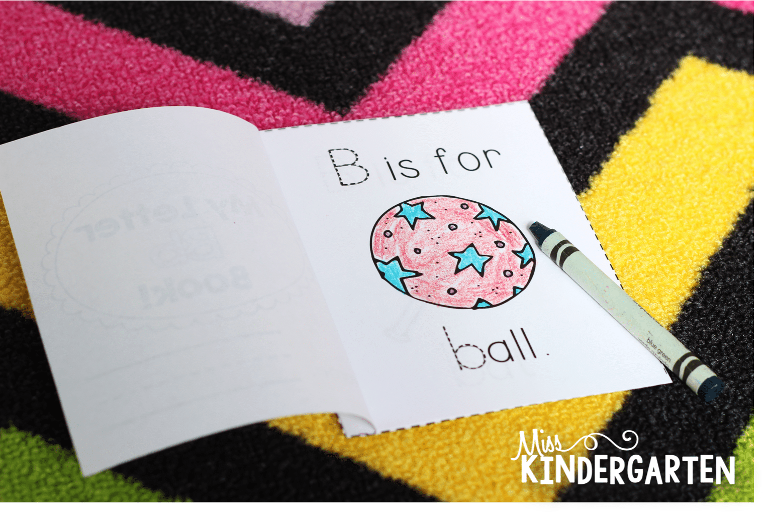 A printable mini-book is open to a page that says "B is for Ball" with a picture of a ball, colored in crayon.