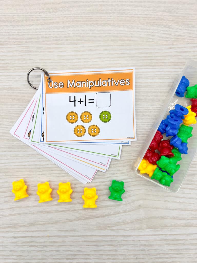 Adding with Manipulatives Task Card on a binder ring