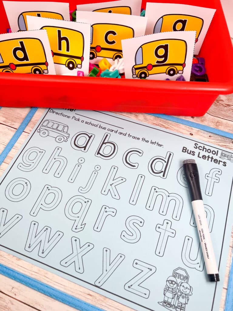 Lowercase letter task cards in a sensory bin with a recording sheet